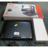 An Akai 10" portable DVD player, with 270 degree swivel screen, model number A51006, boxed.