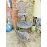 A plastic with gilt metal effect garden table, 68cm high, 69cm diameter, together with two