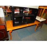 A reproduction mahogany coffee table, with ball and claw feet, 50cm high, 80cm wide, 41cm deep.,