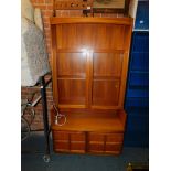 A Nathan teak glazed display cabinet, with upper shelf above two glazed doors and two panelled