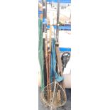 A collection of fly fishing rods, sea fishing rod and a folding landing net, rod tubes and a