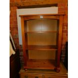 A pine bookcase, enclosing two adjustable shelves, 94cm high, 67cm wide, 28cm deep.