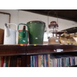 A set of cast iron scales, a tilly lamp, two galvanized buckets, and two watering cans. (5)