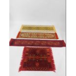 Two late 20thC table runners, one red ground, 179cm x 31cm, the other beige, 146cm x 36cm, a similar