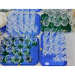 Thirty green stemmed hoch glasses, and cut glass table glassware. (4 trays)
