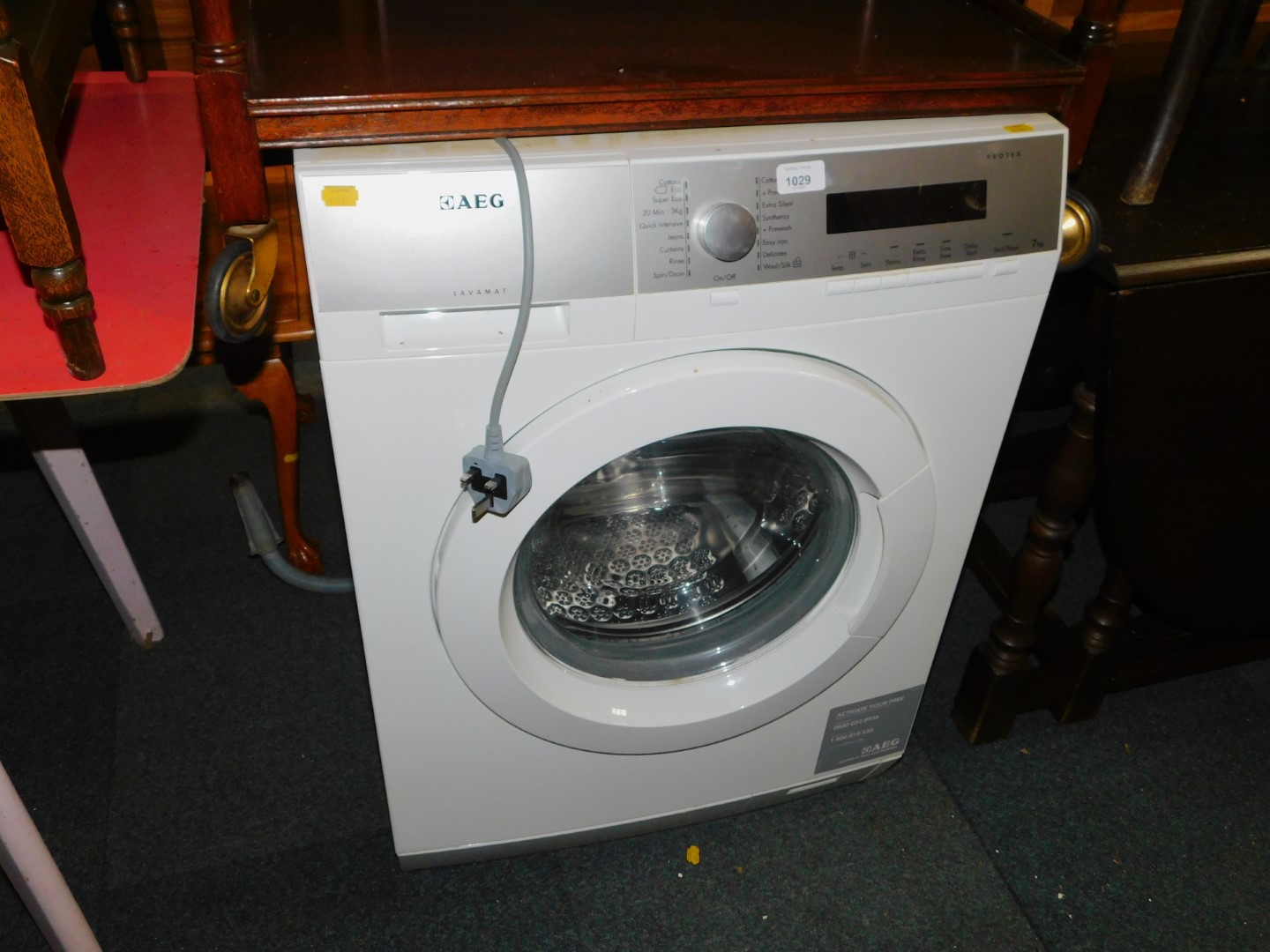 An AEG Lavamat Protex 7kg washing machine, model no L76475FL.