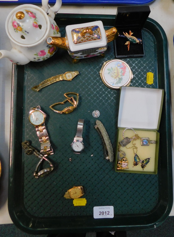 Costume jewellery, to include dress wristwatches, brooches, and a pendant, miniature teapots,