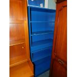 A pair of blue painted MDF bookcases, each 91cm high, 81cm wide, 28cm deep.