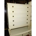 A Butilux French style cream painted chest of five drawers, raised on turned and reeded feet, with a