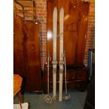A pair of painted wooden ski's, 209cm long, with Northland boot attachments, and two matching