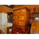 A reproduction mahogany and satinwood strung inlaid chest, of three drawers, raised on bracket feet,