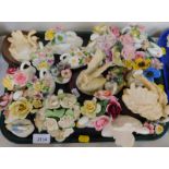 Porcelain pottery and other swan ornaments, some with floral encrustations, including Royal Doulton,