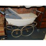 A Silver Cross coach built pram, with blue canvas hood, lacking interior, 132cm long. (AF)