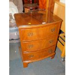 A reproduction mahogany bow front chest, of three drawers, raised on bracket feet, 76cm high, 56cm