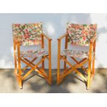 A pair of mid 20thC pine directors chairs, with later rocking bases. (2)