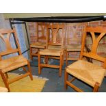 A set of six pine and rush seated kitchen chairs.