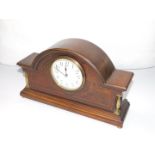 An Edwardian mahogany cased mantel clock, with line inlay, circular enamel dial bearing Arabic