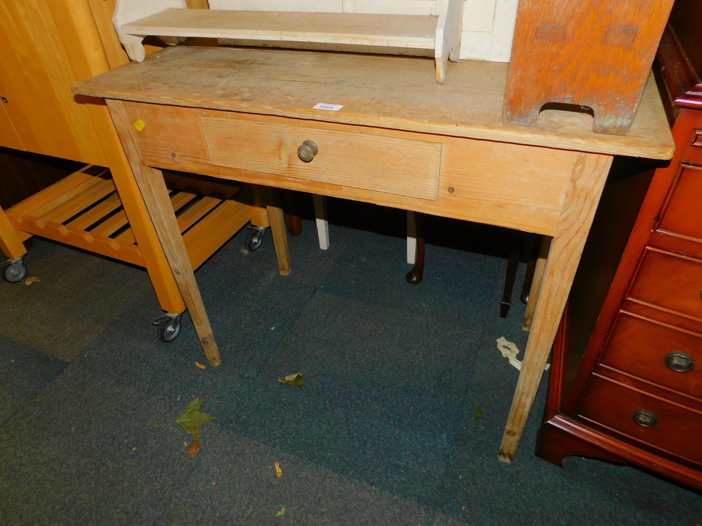 An early 20thC pine lowboy or side table, with single drawer, raised on square tapering legs, 73cm