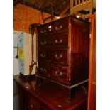 A reproduction mahogany chest, of four graduated drawers, each having two brass swan neck handles,