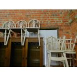 A set of four painted wheel back chairs, two further dining chairs and a painted stool. (7)