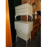 A pair of French style cream painted chests of three drawers, 77cm high, 85cm wide, 22cm deep.,