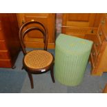 A child's bentwood chair, with caned seat, 60cm high., together with a Lloyd Loom linen basket.,