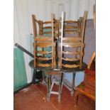 A stained oak drop leaf table, 76cm high, 120cm wide, 87cm deep., together with four oak ladder back