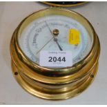 An Acctim brass cased circular wall barometer, 14.5cm diameter.