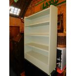 A wooden bookcase, enclosing three adjustable shelves, painted mint green, 108cm high, 76cm wide,