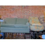 An Oldrid & Co two seater sofa, upholstered in green fabric, together with a futon. (2)
