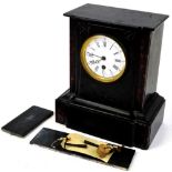 A Victorian slate and marble mantel clock, the shaped case holding a 9cm diameter Roman numeric