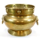 An early 20thC brass jardiniere, of bellied circular form with an upper raised beaded pattern with