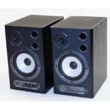 A pair of Behringer MS40 40 watt stereo speakers 24192, in black, with front tuning knops to one,
