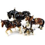 A 20thC pottery heavy horse, a Shire horse with leg raised in black and white colour way, leather