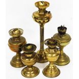 Various early 20thC brass oil lamp bases, to include one with a reeded stem, 49cm high, etc. (a