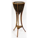 A Victorian mahogany jardiniere stand, with moulded top, reeded baluster and tripod base, 108cm