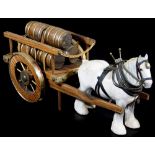 A Beswick shire horse, in grey with leather style tack, 21cm high and a cart set with barrels,