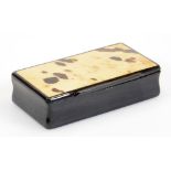 An early 20thC papier mache and blonde tortoise shell finish snuff box, of rectangular form with