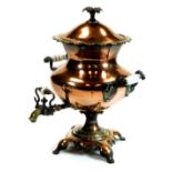 An early 20thC copper and brass samovar, of shaped bellied form on an inverted stem and platform