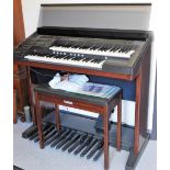 A Yamaha Electone EL-40 keyboard, 102cm high, with stool, manual and wire.