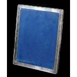 An Elizabeth II silver photograph frame, of oblong form with a bead outline, plain interior and