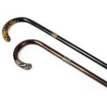 A tiger wood walking cane, with silver collar and end and a further ebonised walking stick with