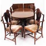 A Regency style mahogany twin pedestal dining table, with two leaves, set with a wide cross