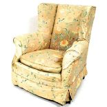 A Victorian wing back armchair, with bun feet and matched upholstery to the previous chair.