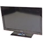 A Samsung 32 inch colour television in black trim, with remote control and wire.