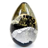 An Ourglass dump, in black gold and cream colours, signed and dated 2009, 14cm high.