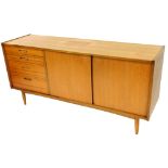 An L Marcus Butilux vintage teak sideboard, of rectangular form set with an arrangement of four