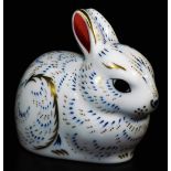 A Royal Crown Derby Collectors Guild paperweight bunny ornament, gilt stopper, 7cm high. (boxed)