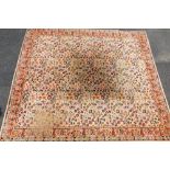A Boltonian seemless square rug, in floral pattern, decorated predominantly in red, blue and yellow,