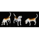 Three matt finish Beswick hounds, comprising two with head lowered 8cm high, one with head